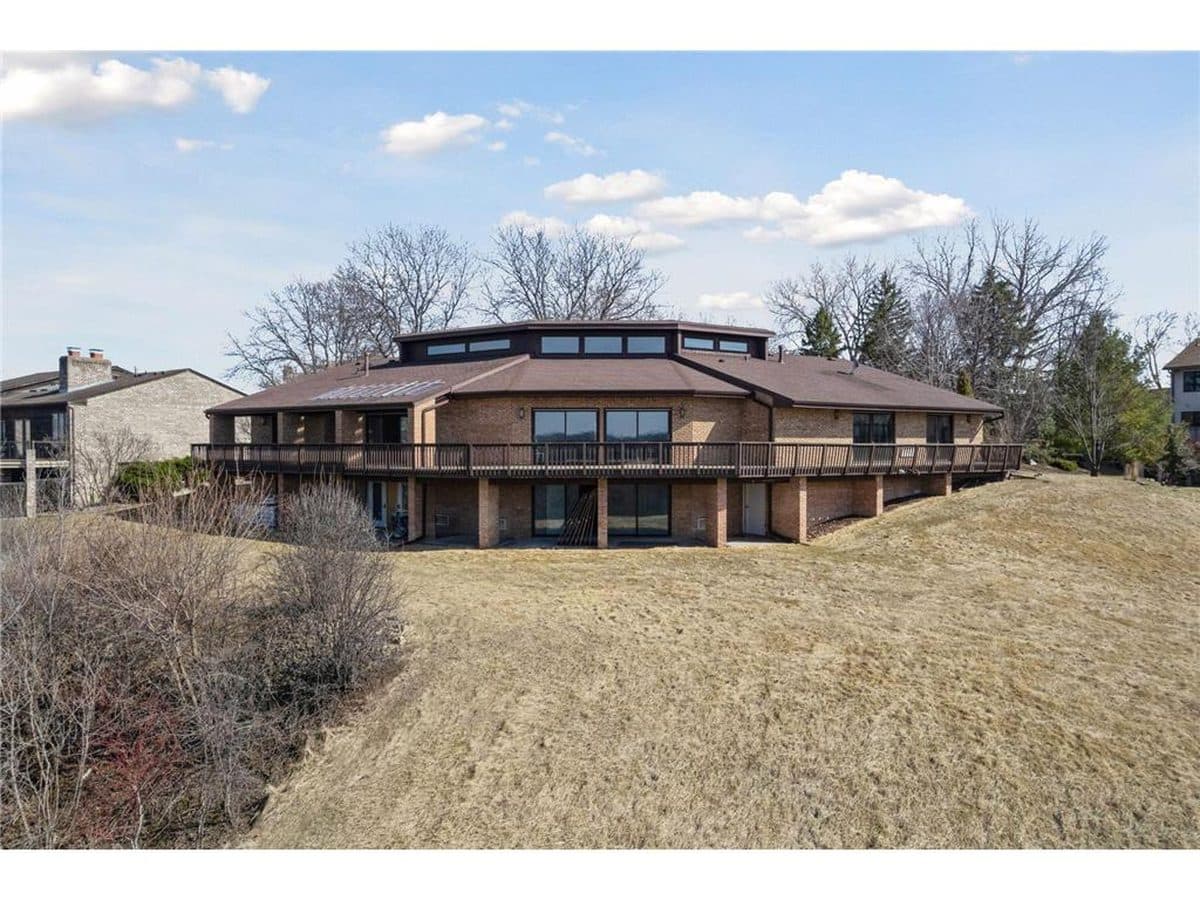 Large all-brick walkout home with a wraparound deck overlooking the river valley in Burnsville, MN