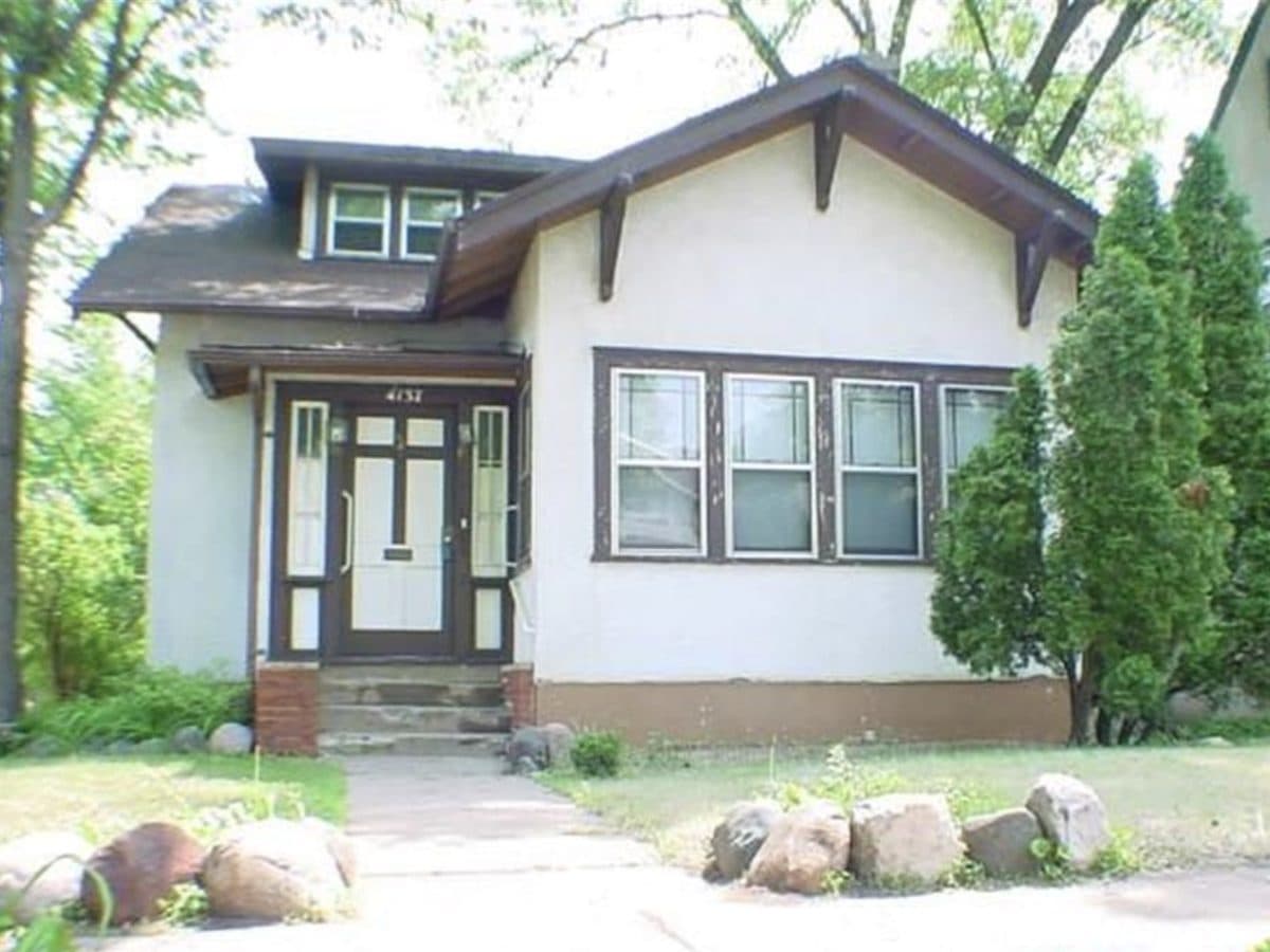 Stucco craftsman-style residential assisted living home in Minneapolis, MN